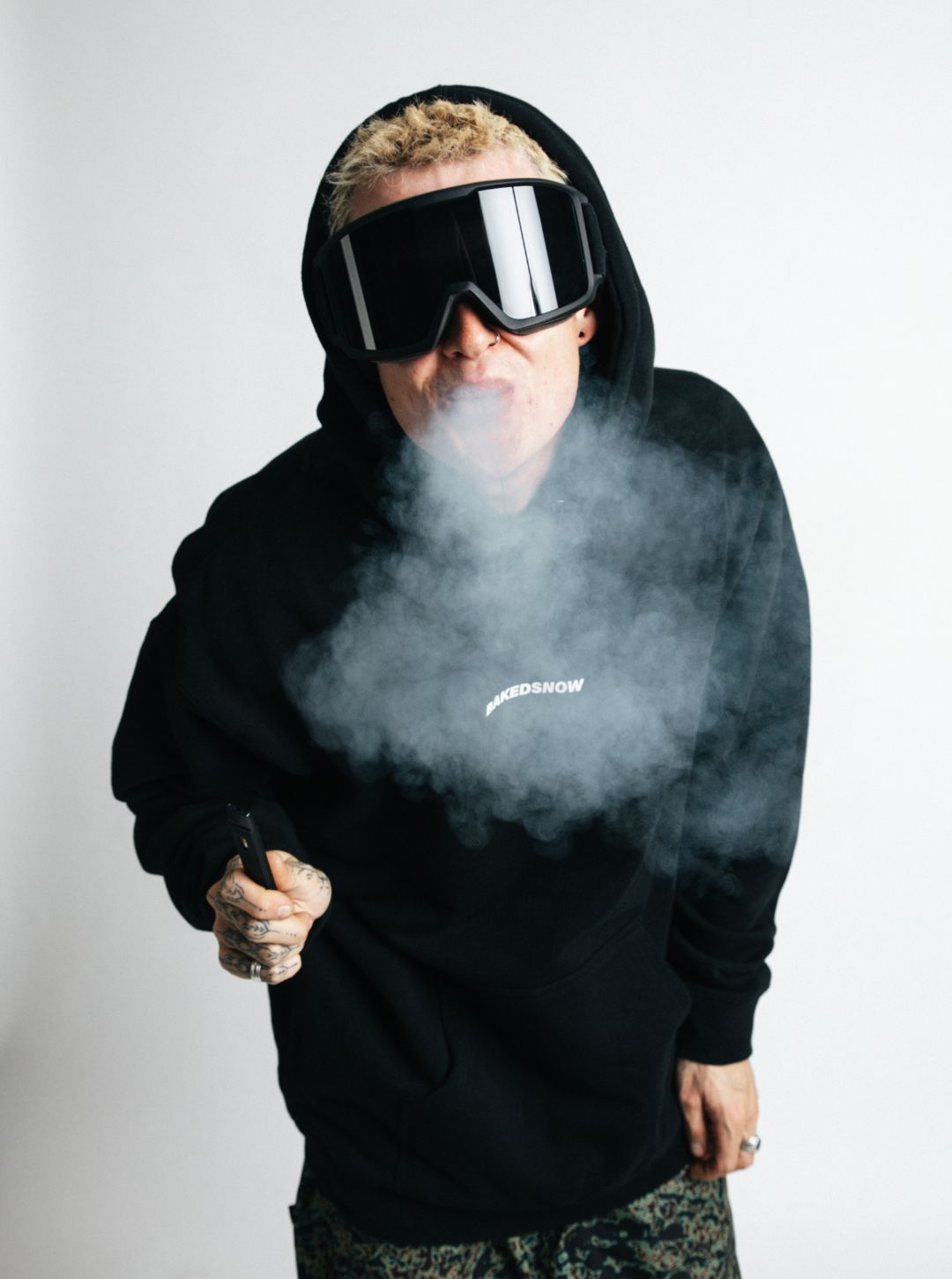 bakedsnow the system snowboard hoodie model shot with smoke